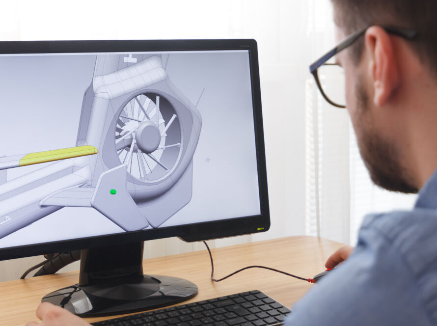 Engineer designing a product on a desktop computer